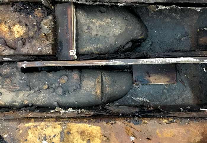 Bare wood and fiberglass-skinned stringers