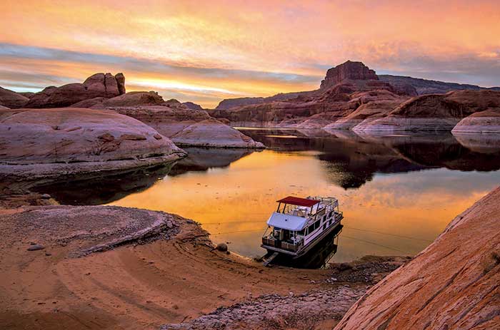 Houseboat overnights tucked among the red rocks of Glen Canyon